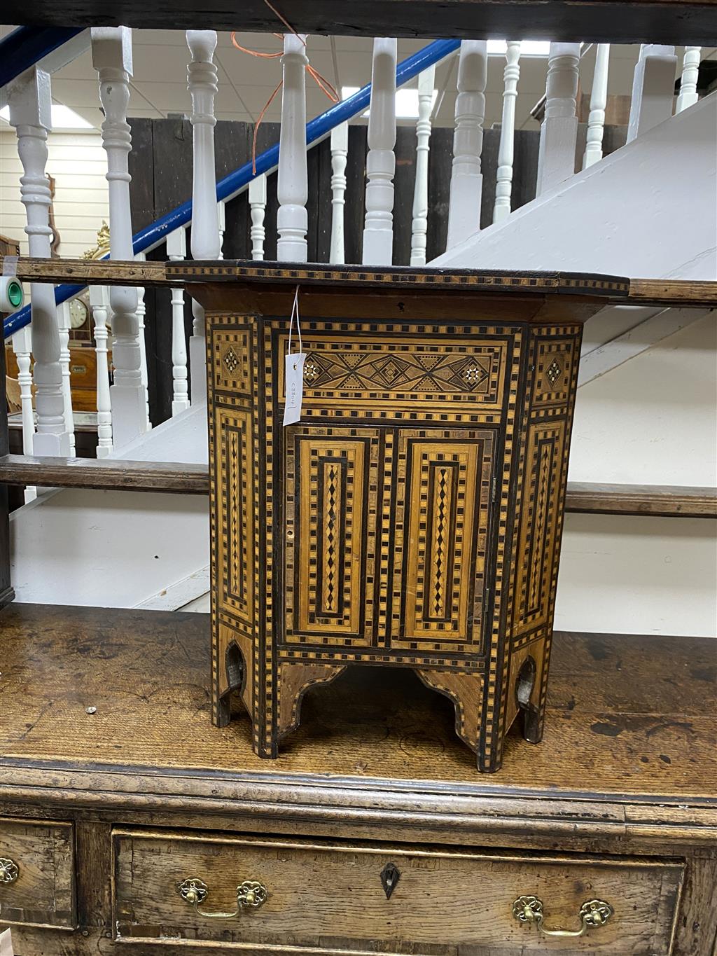 A Moorish octagonal mother of pearl inlaid work table, width 50cm, depth 33cm, height 56cm